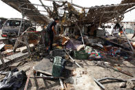 <p>People gather at the site of a car bomb attack in Baghdad’s mainly Shiite district of Sadr City, Iraq, on May 17, 2016. (Khalid al Mousily/Reuters)</p>