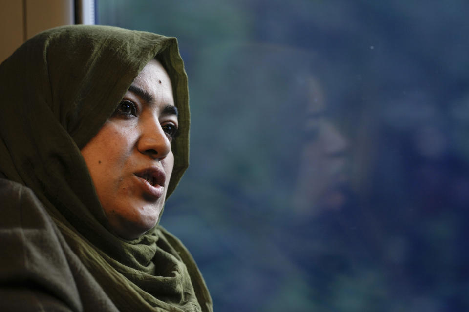 Batool Haidari, 37, talks during an interview with the Associated Press on a train taking her from her home on the outskirts of Rome, to the capital's center, Monday, Dec. 5, 2022. Batool Haidari was a prominent professor of sexology at a university in Kabul before last year’s Taliban takeover of Afghanistan. She used to lecture mixed classes of male and female students and look after her patients struggling with their gender identity. That comfortable life came to an abrupt halt on Aug. 15, 2021, when the ultra-religious group swept back into power. (AP Photo/Andrew Medichini)