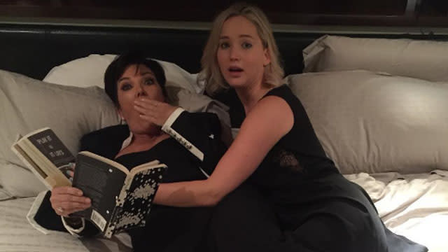 They may have been caught in bed together, but <strong>Jennifer Lawrence</strong> and <strong>Kris Jenner</strong> aren't actually besties -- yet. <em> The Hunger Games</em> star spoke with <em>The New York Times</em>' reporter Brooks Barnes, who revealed the story behind that OMG-worthy pic on Twitter. <strong>NEWS: Kris Jenner Gets Caught in Bed With Jennifer Lawrence</strong> "My two best friends planned a surprise birthday party with a big surprise within the surprise," Jennifer explained. You don't say? As people started singing "Happy Birthday" to Jennifer, her biggest dream started to come true. "Kris Jenner comes out holding my cake, which is a pile of s**t, with a sign that says, 'Happy Birthday You Pile of S**t.' My knees buckled," she said. Obvs they did. The die-hard Kardashian fan was apparently so excited that she literally fell down. But, hey, she's done that before. <strong>WATCH: Jennifer Lawrence & Amy Schumer on a Jet Ski Is Our New Squad Goal</strong> "It was the closest I've ever come to losing consciousness," Jennifer said. "I had NO IDEA. I'd never met her before but we’ve always watched <em>Keeping Up With the Kardashians</em>. And then Kris Jenner and I sang 'Build Me Up Buttercup' on karaoke and took that picture." And that picture refers to this picture: We have so many questions. Where exactly was this birthday party that there was both a bed and karaoke machine in close proximity to one another? What does a s**t cake look like? Is it like a poop emoji in dessert form? Is Jennifer officially a member of the Kardashian krew now? Can Kris legally adopt a grown 25-year-old woman and become her momager? And, most importantly, why haven't we seen that karaoke video? Kris, 59, posted the original jaw-dropping photo, which was taken by her boyfriend, <strong>Corey Gamble</strong>. "Happy Birthday you piece of s**t," she captioned the Instagram. "God I love you #jenniferlawrence thanks for making this night a night to remember…..even if we did get caught… I love you Happy Birthday Gorgeous!!!" <strong>WATCH: Kris Jenner on Her 'Hero Right Now' Kourtney Kardashian</strong> Are you sensing a theme, or just the fact that they really love saying s**t? We're actually fine with both, but we have to be, otherwise we'll focus too long on how we wish we could correct that punctuation. Sorry. We'll go back to letting you enjoy the glory that was J.Law’s birthday moment, and also, more GIFs of her because they are everything. There we go! Kris will make a fine addition to Jennifer's #GirlSquad, which already includes Amy Schumer. Lucky for us, J.Law will be collaborating with the comedian soon. Find out about the movie project in the video below.