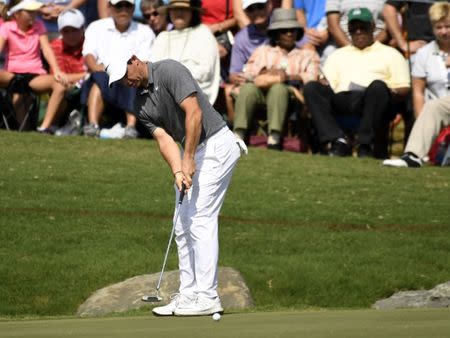 Aug 11, 2017; Charlotte, NC, USA; Rory McIlroy putts on the 18th green during the second round of the 2017 PGA Championship at Quail Hollow Club. Mandatory Credit: Michael Madrid-USA TODAY Sports