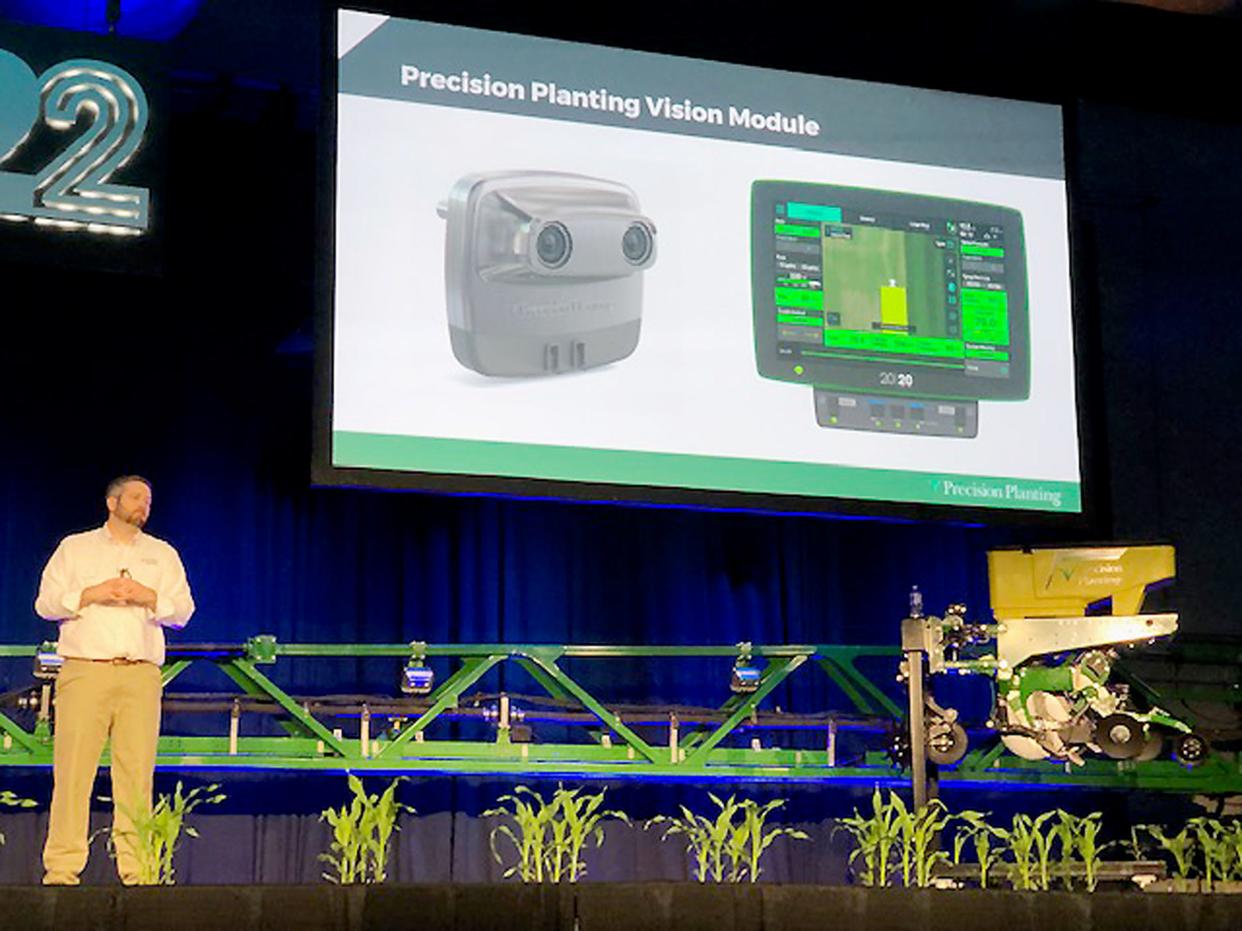 Justin McMenamy of Precision Planting explains new products by his company at the Precision Planting Winter Conference near Tremont recently.