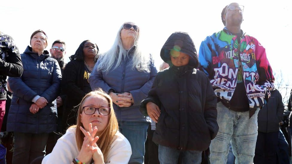 Community members in Rockfield, Illinois gather at a vigil held for victims of the deadly stabbing spree