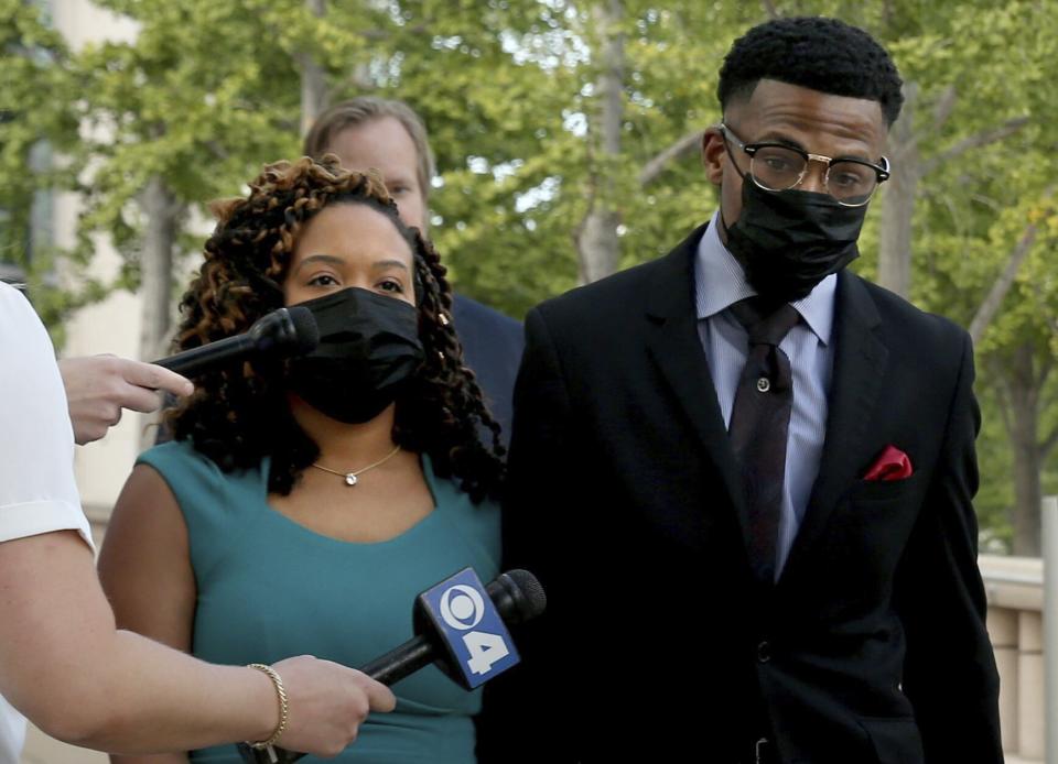 Former St. Louis Alderman John Collins-Muhammad leaves the Thomas Eagleton Federal Courthouse with his wife, Asia Collins-Muhammad, on Tuesday, Aug. 23, 2022, after pleading guilty in a federal corruption case, in St. Louis. (Christian Gooden/St. Louis Post-Dispatch via AP)