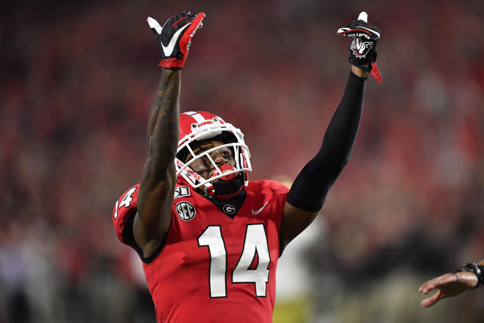 Georgia defensive back DJ Daniel (14) celebrates victory over Notre Dame during the second half of an NCAA college football game, Saturday, Sept. 21, 2019, in Athens, Ga. Georgia won 23-17. (AP Photo/Mike Stewart)