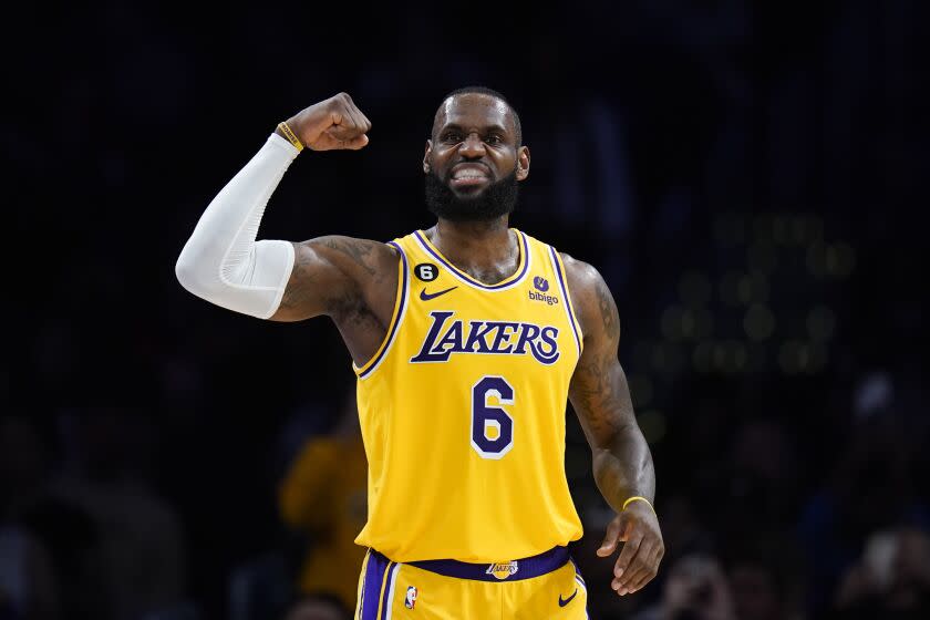 Laker LeBron James flexes his arm during a win over the Rockets