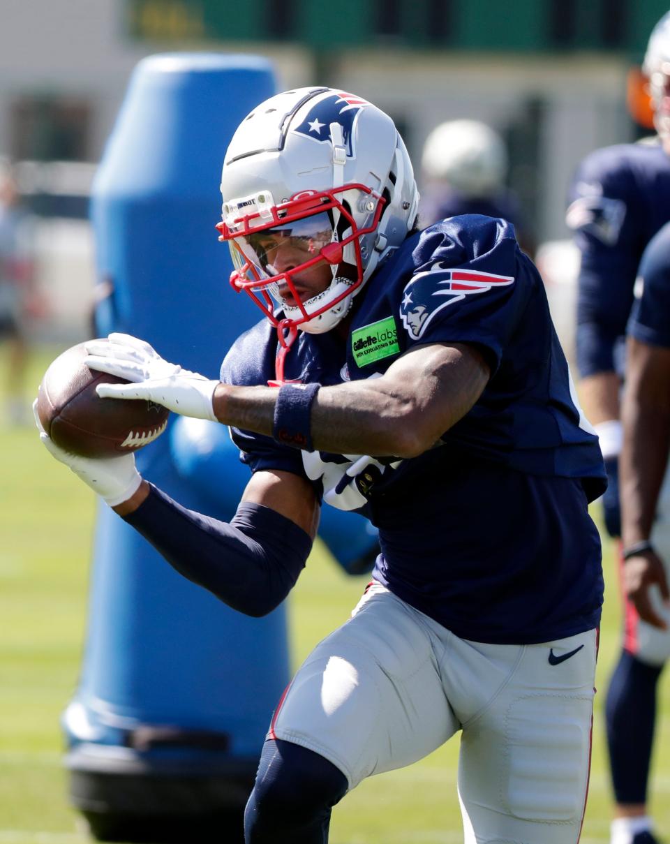 New England Patriots wide receiver Demario Douglas (81) catches a pass during a joint practice with the Green Bay Packers on Aug. 16, 2023, in Ashwaubenon, Wis.