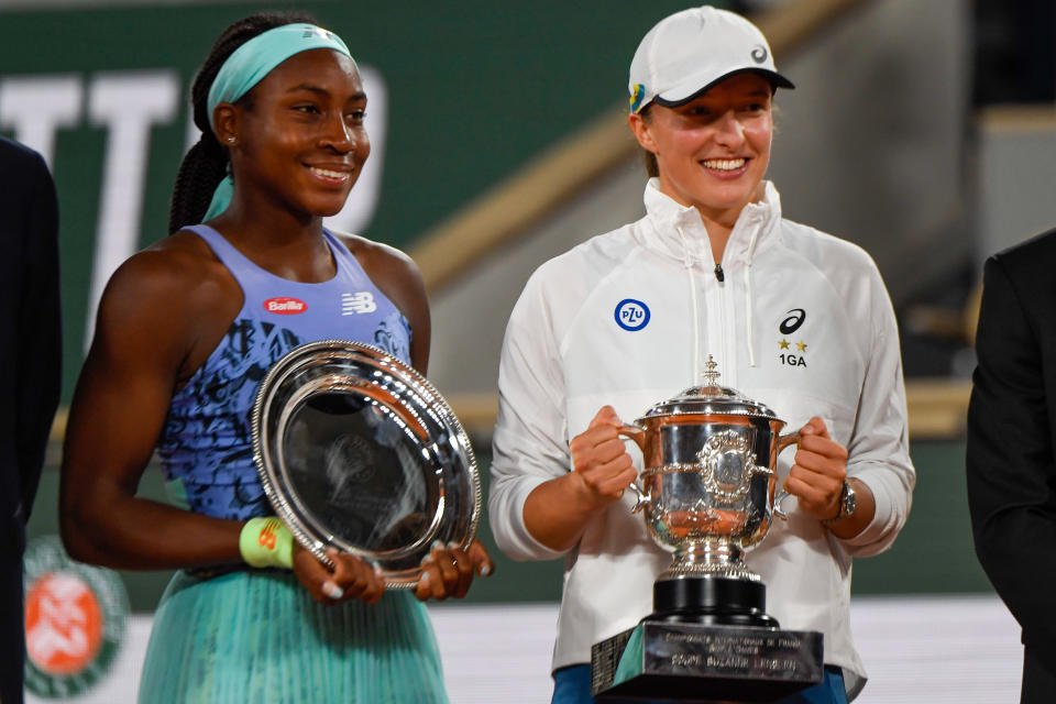 Coco Gauff and Iga Swiatek, pictured here with their trophies after the French Open final.