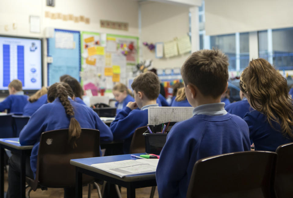 File photo dated 27/11/19 of school children during a Year 5 class at a primary school. Schools may feel like a "strange place" to pupils when they return next month due to safety measures amid the coronavirus pandemic, a leading psychiatrist has warned.