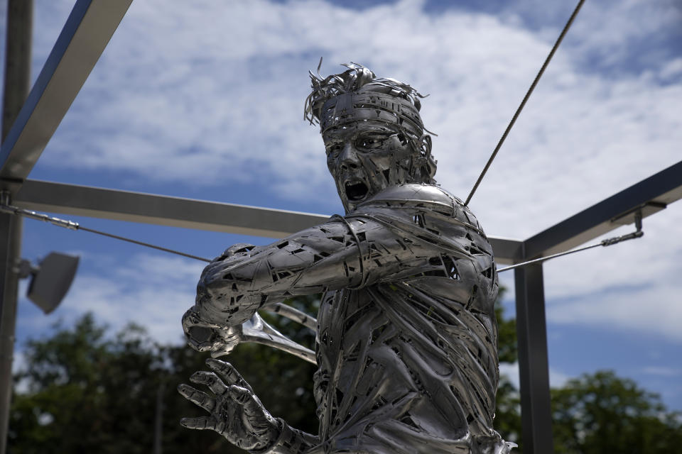 A statue of Spanish artist Jordi Diez representing Spain's Rafael Nadal is seen at the Roland Garros stadium, in Paris, Friday, May 28, 2021. (AP Photo/Christophe Ena)