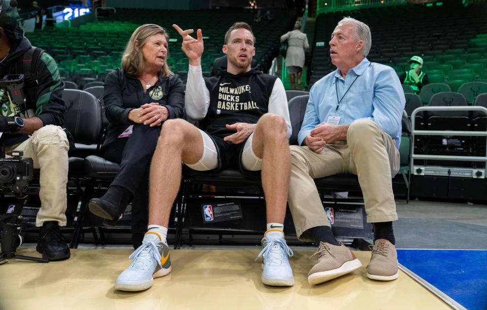 Bucks guard Pat Connaughton visits with his parents, Sue and Len, before the team's regular-season opener Oct. 26.