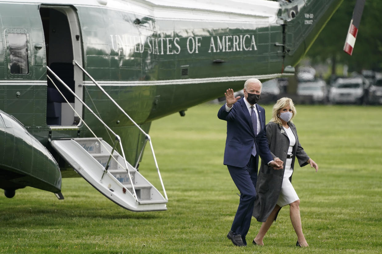 President Joe Biden and first lady Jill Biden step off Marine One on the Ellipse near the White House, Monday, May 3, 2021, in Washington.  The Biden's traveled Monday to coastal Virginia to promote his plans to increase spending on education and children, part of his $1.8 trillion families proposal announced last week. (AP Photo/Patrick Semansky)