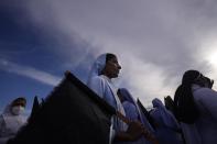 Catholic nuns march during a protest near the president's official residence in Colombo, Sri Lanka, Saturday, May 28, 2022. Police fired tear gas and water canon on protesters who marched toward the president Gotabaya Rajapaksa's barricaded residence demanding his resignation. (AP Photo/Eranga Jayawardena)