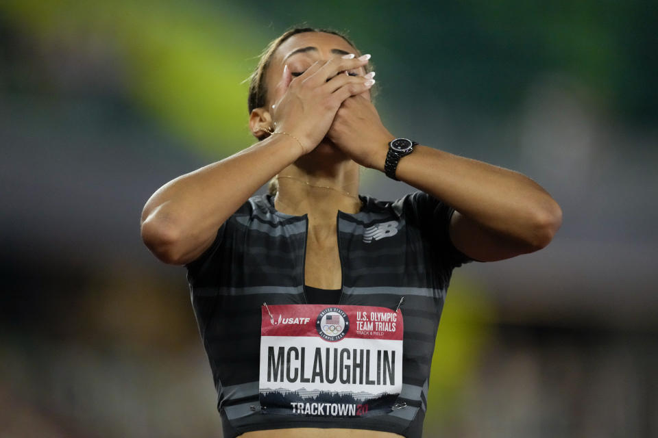 Sydney McLaughlin reacts after setting a new world record in the finals of the women's 400-meter hurdles at the U.S. Olympic Track and Field Trials Sunday, June 27, 2021, in Eugene, Ore. (AP Photo/Ashley Landis)