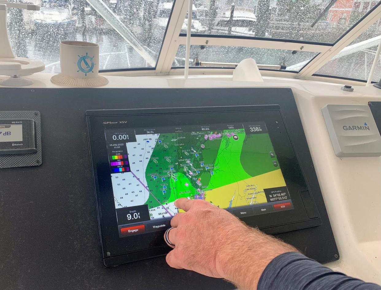 Stan Cook, the friend who reported Carolina Beach boater Joseph Johnson missing in November, uses technology to point out the area off Bald Head Island where Johnson was likely heading to fish before not returning home last year.