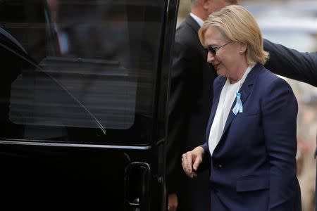 U.S. Democratic presidential candidate Hillary Clinton climbs into her van outside her daughter Chelsea's home in New York, New York, United States September 11, 2016, after Clinton left ceremonies commemorating the 15th anniversary of the September 11 attacks feeling "overheated." REUTERS/Brian Snyder