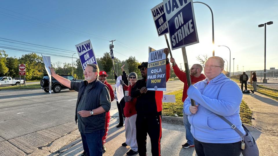 UAW members strike against the 