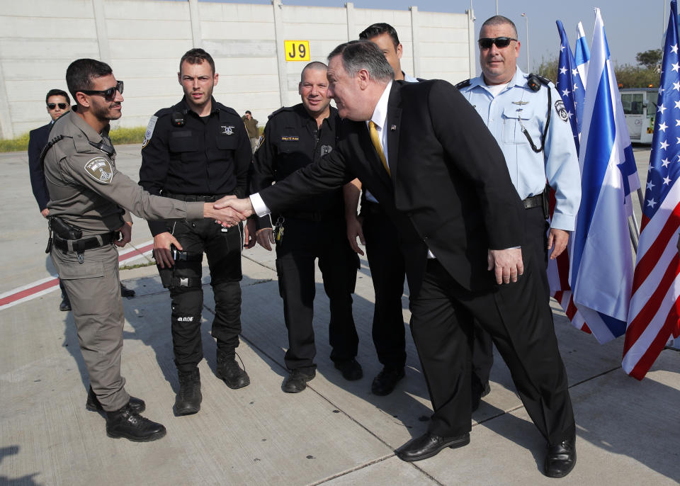 U.S. Secretary of State Mike Pompeo greets an Israeli border policeman before boarding his airplane to Beirut at Ben Gurion airport near Lod, Israel, Friday, March 22, 2019. (Jim Young/Pool Photo via AP)