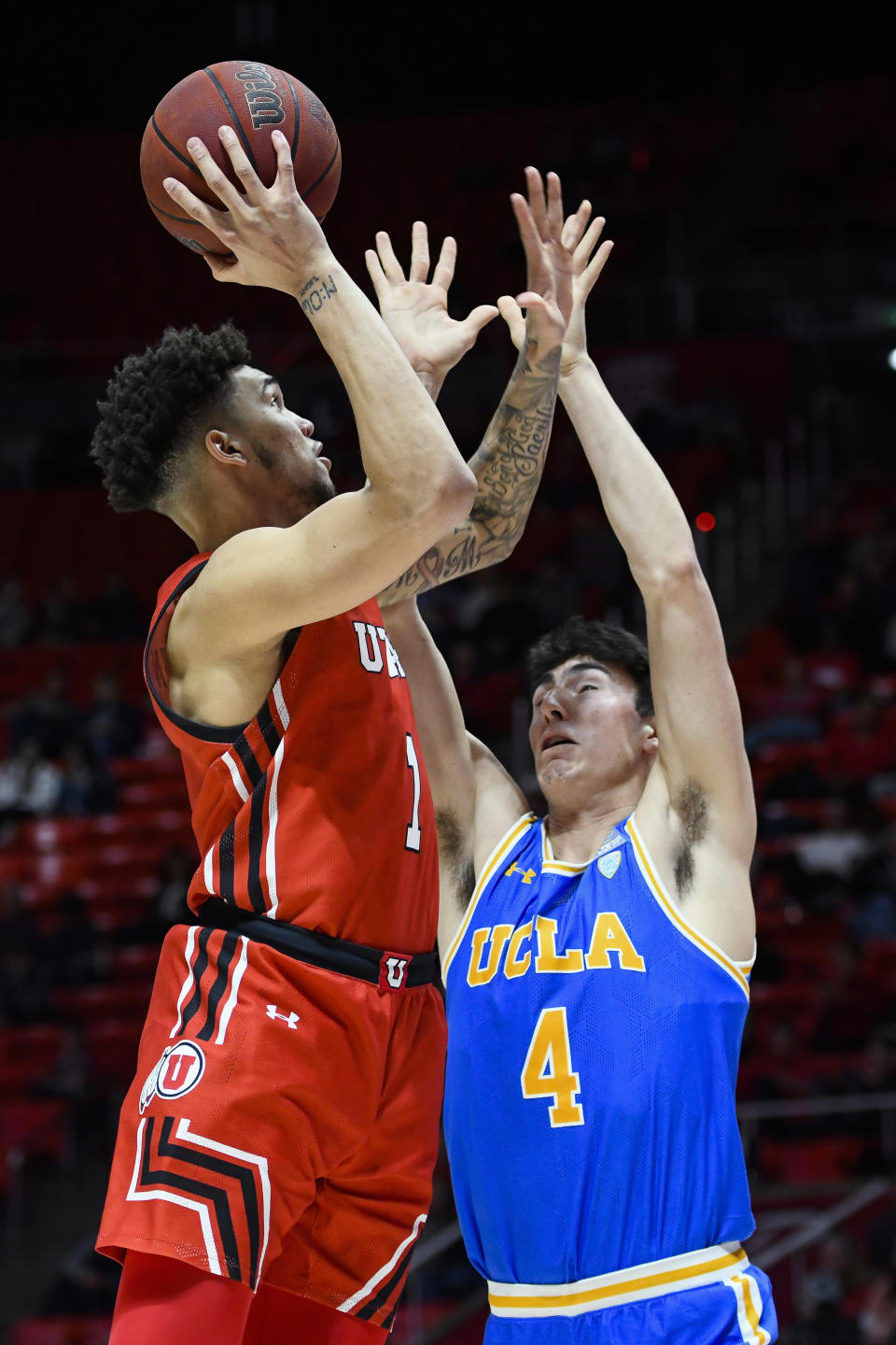 Utah forward Timmy Allen (1) shoots over UCLA guard Jaime Jaquez Jr. during the second half of an NCAA college basketball game Thursday, Feb. 20, 2020, in Salt Lake City. (AP Photo/Alex Goodlett)