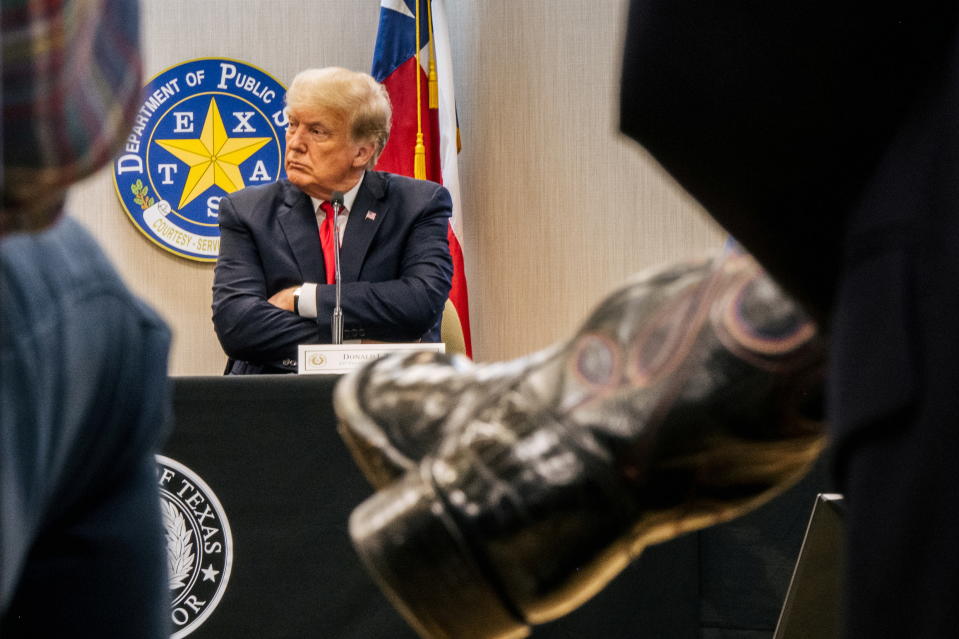 Former U.S. President Donald Trump listens during a border security briefing with Texas Governor Greg Abbott to discuss security at the U.S. southern border with Mexico in Weslaco, Texas, U.S. June 30, 2021. Brandon Bell/Pool via REUTERS     TPX IMAGES OF THE DAY