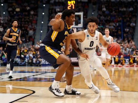 Mar 21, 2019; Hartford, CT, USA; Marquette Golden Eagles guard Markus Howard (0) drives to the basket against Murray State Racers forward Darnell Cowart (32) during the second half off a game in the first round of the 2019 NCAA Tournament at XL Center. Mandatory Credit: David Butler II-USA TODAY Sports