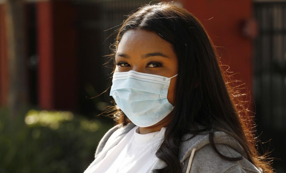 A portrait of a girl wearing a mask