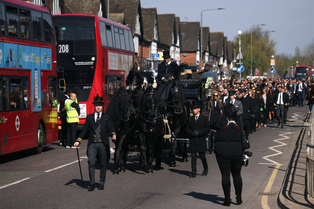 ORPINGTON, ENGLAND - APRIL 20: A horse-drawn hearse leads a procession through Orpington before a funeral service for Tom Parker at St Francis of Assisi church on April 20, 2022 in Orpington, England. British singer Tom Parker, a member of popular boy band The Wanted, died at the age of 33 after being diagnosed with an inoperable brain tumour. (Photo by Dan Kitwood/Getty Images)