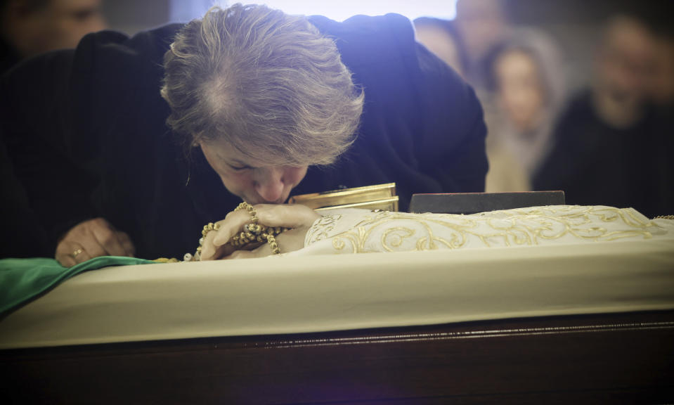 A believer pays her last respects to Bulgarian patriarch Neophyte at the Alexander Nevsky Cathedral in Sofia, Friday, March 15, 2024. National mourning was declared by the Bulgarian government on March 15 and 16 to honour Patriarch Neophyte of Bulgaria. Neophyte who was the first elected head of the Orthodox Church in the post-communist Balkan country, died at a hospital in Sofia on March 13. He was 78. AP Photo/Valentina Petrova)