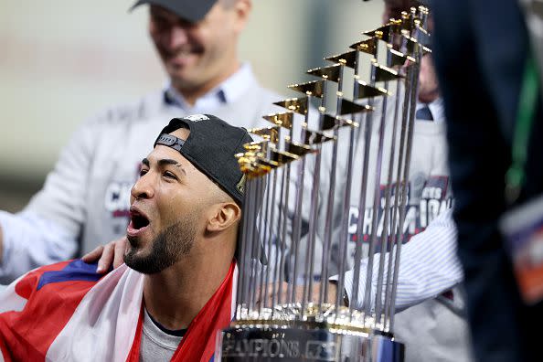 HOUSTON, TEXAS - NOVEMBER 02:  Eddie Rosario #8 of the Atlanta Braves celebrates after the team's 7-0 victory against the Houston Astros in Game Six to win the 2021 World Series at Minute Maid Park on November 02, 2021 in Houston, Texas. (Photo by Elsa/Getty Images)