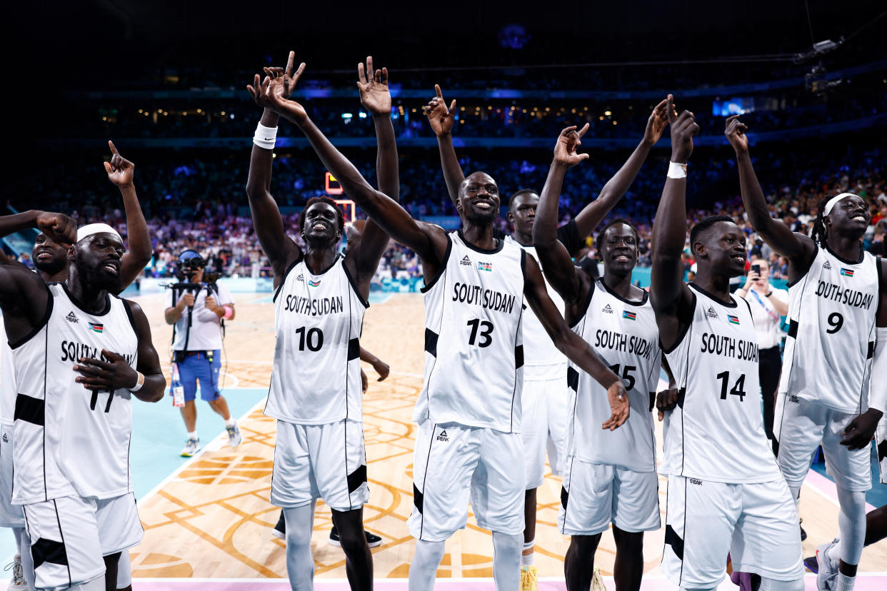 South Sudanese players celebrate last week's victory over Puerto Rico. (Sameer Al-Doumy/AFP via Getty Images)