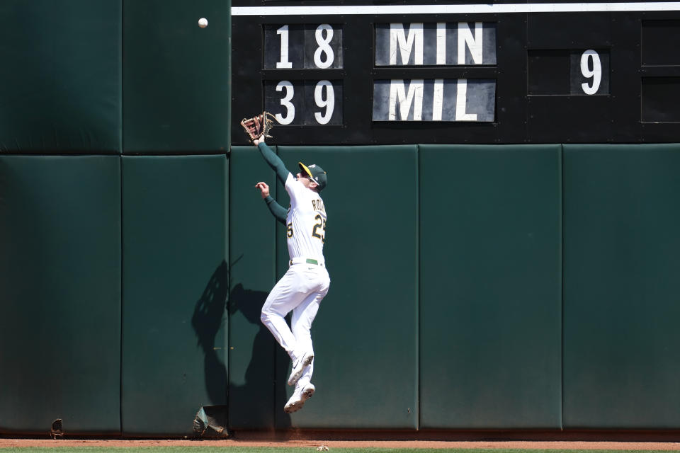 Oakland Athletics right fielder Brent Rooker catches a fly out hit by Kansas City Royals' Freddy Fermin during the sixth inning of a baseball game in Oakland, Calif., Wednesday, Aug. 23, 2023. (AP Photo/Jeff Chiu)