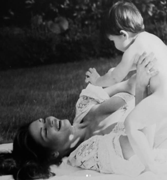 Catherine zeta-jones plays with her son Dylan in old black-and-white photo