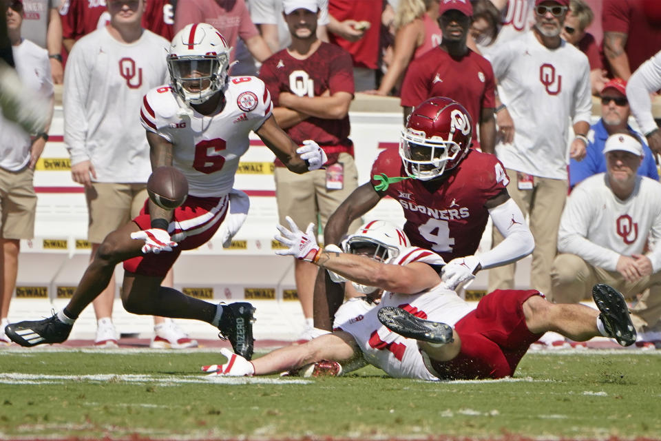 Nebraska cornerback Quinton Newsome (6) and linebacker JoJo Domann, right, break up a pass intended for Oklahoma wide receiver Mario Williams (4) in the first half an NCAA college football game, Saturday, Sept. 18, 2021, in Norman, Okla. (AP Photo/Sue Ogrocki)