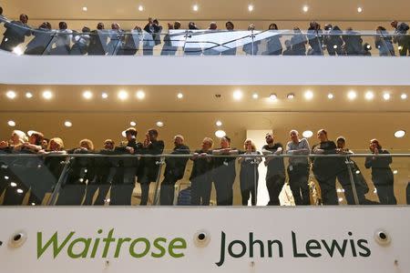John Lewis and Waitrose employees wait for the announcement of their 2016 results linked bonus, at their flagship store in central London, Britain March 10, 2016. REUTERS/Stefan Wermuth