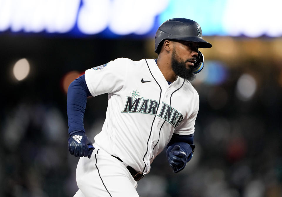 Seattle Mariners' Teoscar Hernandez rounds the bases after hitting a three-run home run, his second home run of the game, against the Los Angeles Angels in the fifth inning of a baseball game Tuesday, April 4, 2023, in Seattle. (AP Photo/Lindsey Wasson)