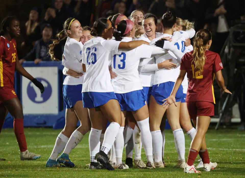 BYU midfielder Bella Folino (22) celebrates her goal against USC with BYU midfielder Olivia Katoa (10) and BYU forward Allie Fryer (23) during the second round of the NCAA championship in Provo on Thursday, Nov. 16, 2023. BYU won 1-0. | Jeffrey D. Allred, Deseret News