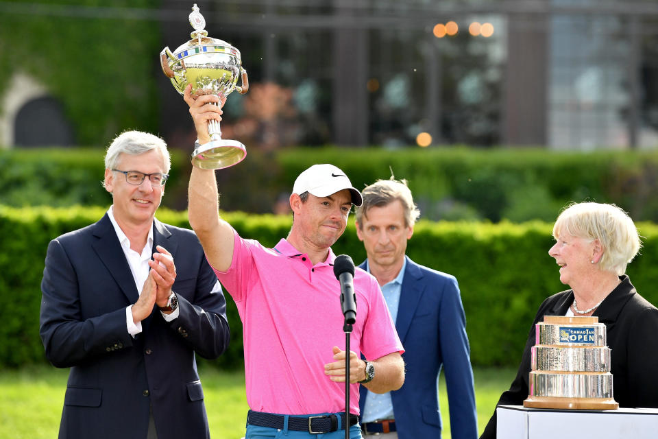 Rory McIlroy (pictured) hoists the trophy after winning the RBC Canadian Open.