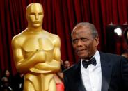 FILE PHOTO: Presenter and actor Sidney Poitier arrives at the 86th Academy Awards in Hollywood