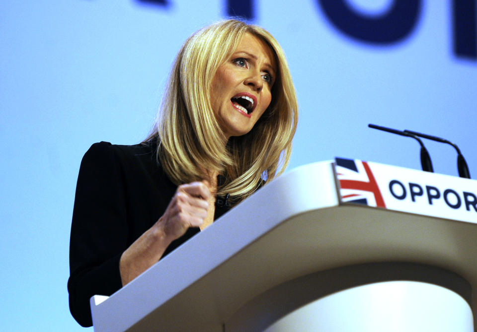 Secretary of State for Work and Pensions Esther McVey addresses delegates during a speech at the Conservative Party Conference at the ICC, in Birmingham, England, Monday, Oct. 1, 2018. (AP Photo/Rui Vieira)