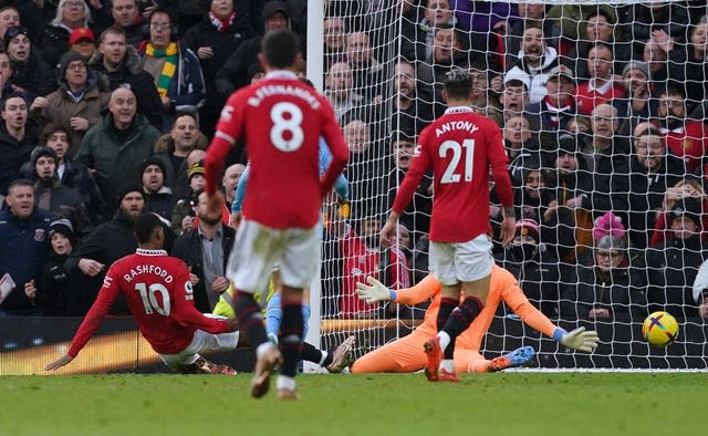 Marcus Rashford scores Manchester United's winner against Manchester City (Martin Rickett/PA).