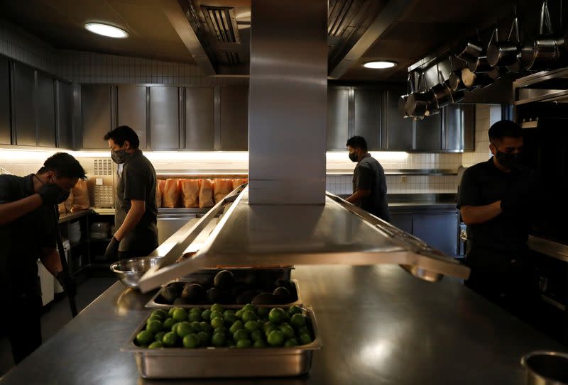 FILE PHOTO: Employees of Chef Enrique Olvera's Pujol restaurant prepare food baskets to deliver to local customers with products from their local suppliers, whose protection in tough financial times has become a priority. in Mexico City