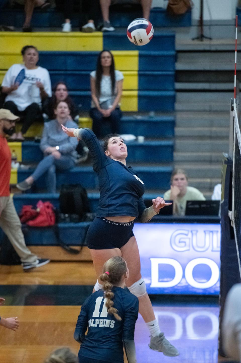 Sydney Sutter (13) plays the ball during the Navarre vs Gulf Breeze volleyball match at Gulf Breeze High School on Thursday, Sept. 28, 2023.