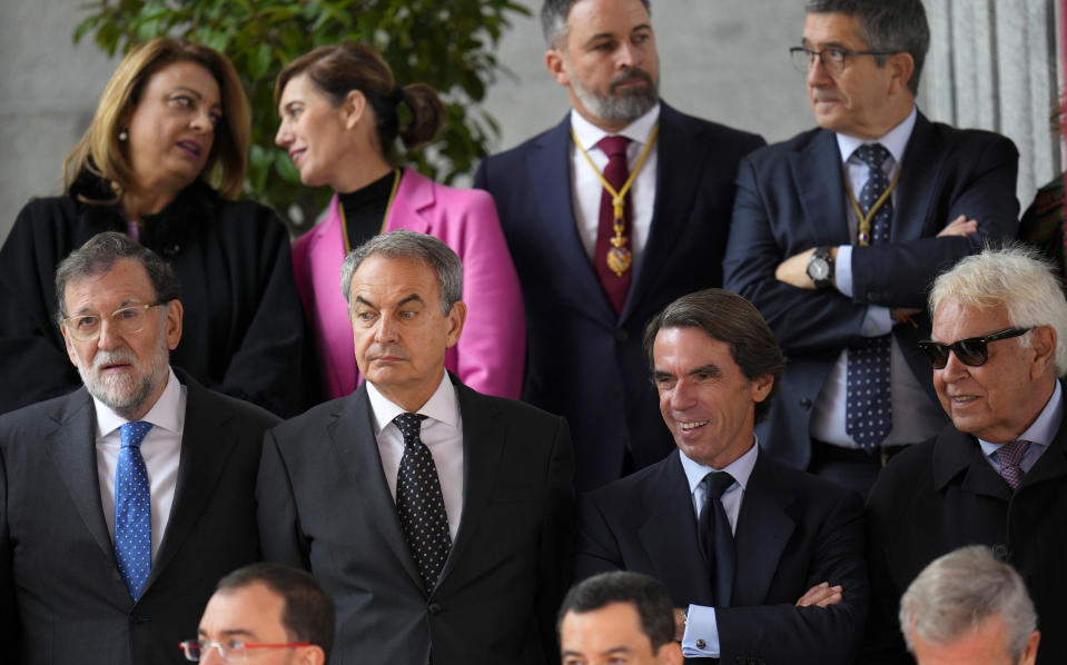 Former Spanish prime ministers Mariano Rajoy, Jose Luis Rodriguez Zapatero, José María Aznar and Felipe Gonzalez, from left to right, stand outside the Spanish parliament during a parade, following the swearing allegiance in the Constitution by Princess Leonor, in Madrid on Tuesday, Oct. 31 2023. The heir to the Spanish throne, Princess Leonor, has sworn allegiance to the Constitution on her 18th birthday. Tuesday's gala event paves the way to her becoming queen when the time comes. Leonor is the eldest daughter of King Felipe and Queen Letizia. (AP Photo/Manu Fernandez)