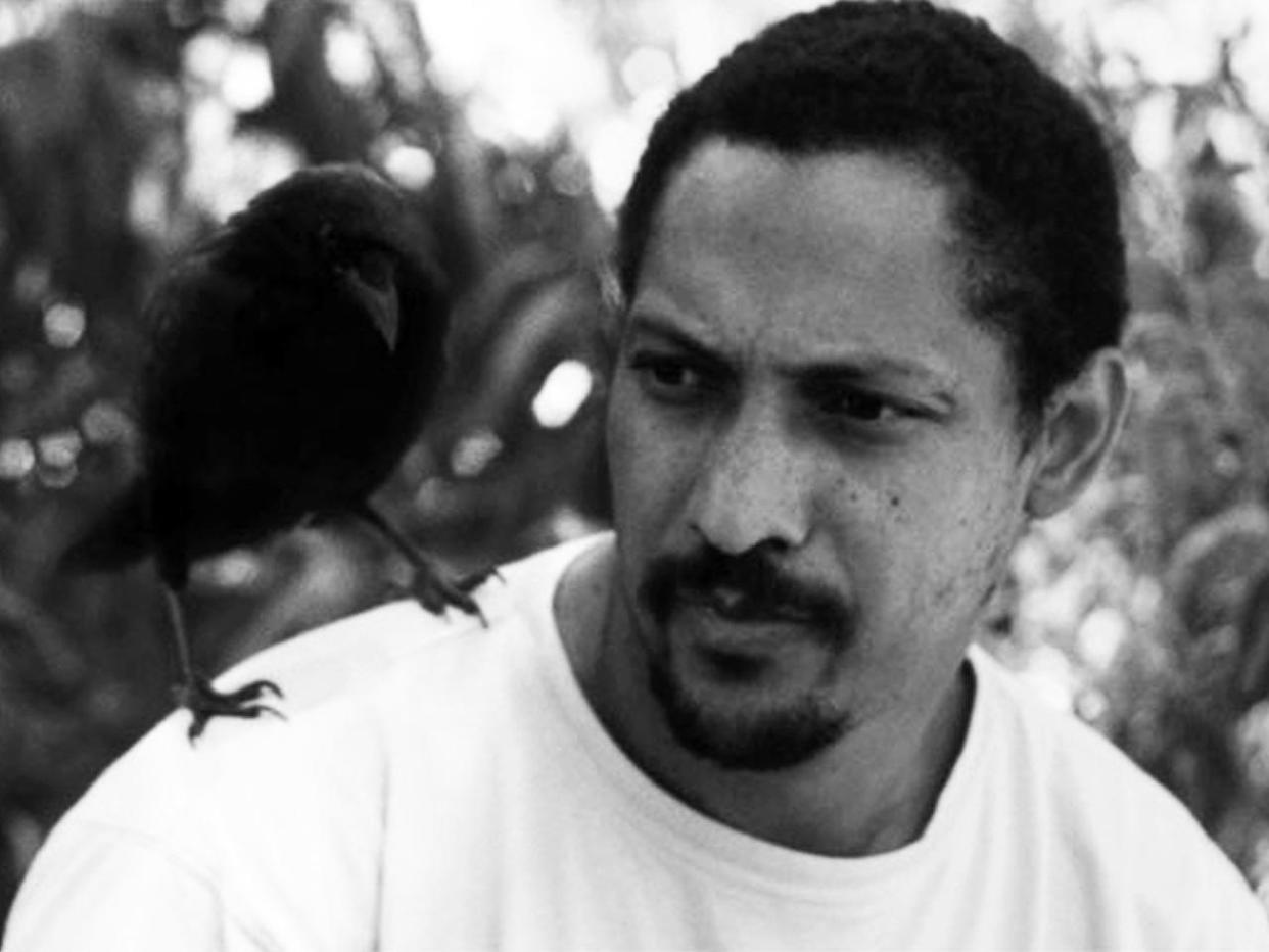 An undated photo of author Percival Everett with his pet crow, Jim.  / Credit: Percival Everett