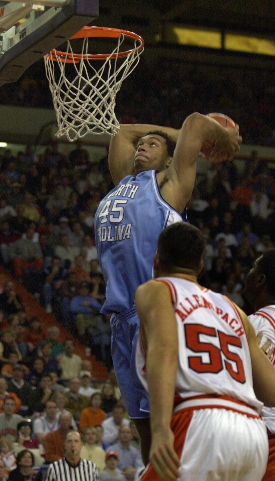 UNCCLEMSON3.SP.021801.TSS--CLEMSON,S.C.--UNC’s Julius Peppers goes up for a dunk over Clemson’s Adam Allenspach (cq) in second half action of the Tar Heels upset loss to the Tigers in Littlejohn Coliseum, Feb. 18, 2001.