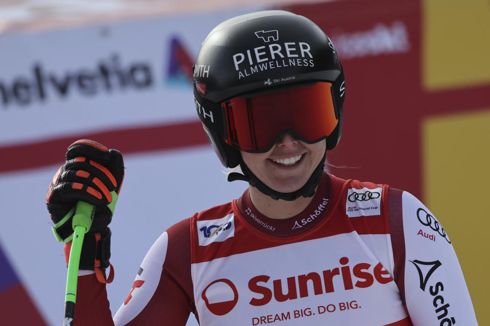 Austria's Cornelia Huetter reacts after completing an alpine ski, women's World Cup downhill race, in Crans Montana, Switzerland, Friday, Feb. 16, 2024. (AP Photo/Marco Trovati)