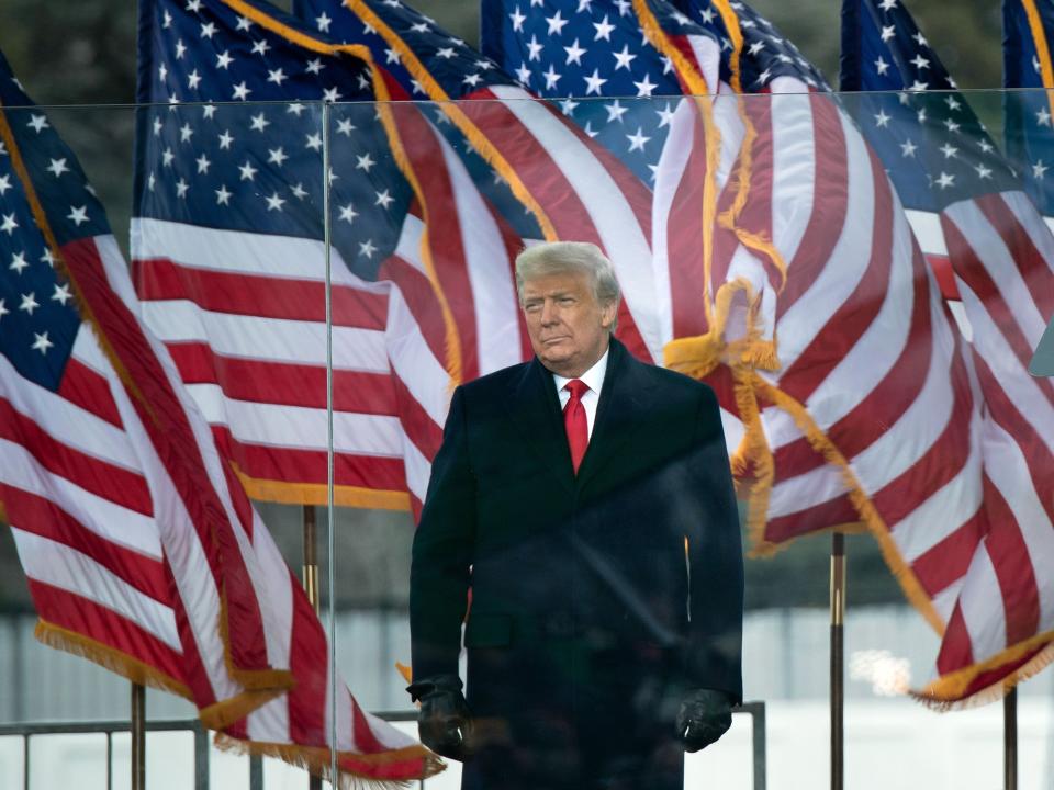 Trump in front of US flags on January 6