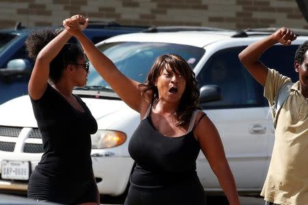 People yell slogans across the street from a a Black Lives Matter protest following the multiple police shootings in Dallas, Texas, U.S., July 10, 2016. REUTERS/Carlo Allegri