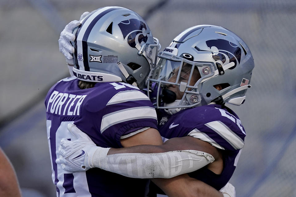 Kansas State running back Deuce Vaughn, right, celebrates with Kansas State wide receiver Seth Porter after scoring a touchdown during the first half of an NCAA college football game against South Dakota Saturday, Sept. 3, 2022, in Manhattan, Kan. (AP Photo/Charlie Riedel)