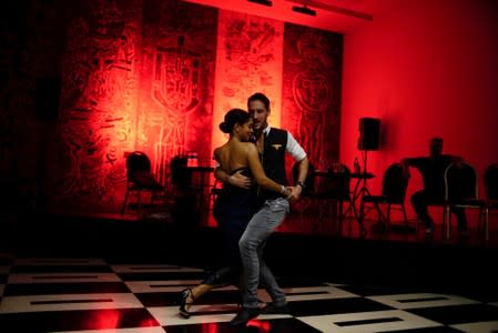 People dance tango in a hotel in Havana