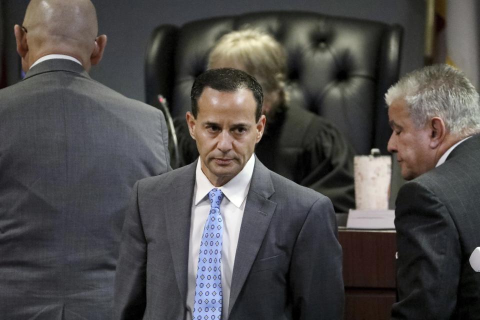 Pinellas-Pasco assistant state attorneys Scott Rosenwasser, center, leaves the bench after conferring with Florida 6th Circuit Court judge Susan Barthle during a break in testimony by former Tampa police captain Curtis Reeves who took the stand in his own defense on Thursday, Feb 24, 2022, at the Robert D. Sumner Judicial Center in Dade City, Fla. Reeves is accused of shooting and killing Chad Oulson at a Wesley Chapel movie theater in January 2014. (Douglas R. Clifford/Tampa Bay Times via AP, Pool)